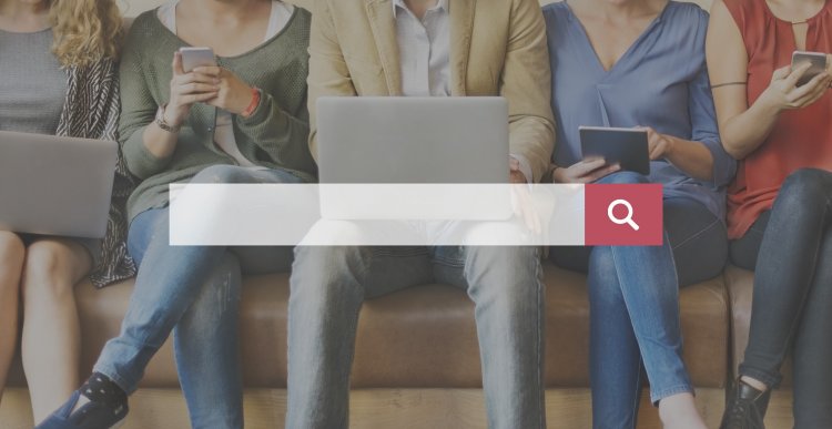truthfinder online background check services plans pricing search bar people with laptops and phones in the background